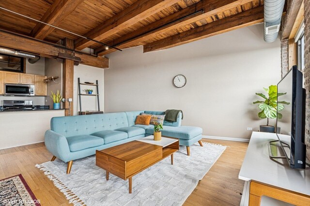 1735 W Diversey Pkwy Unit 402, Chicago, IL 60614 - living room featuring wooden ceiling with exposed beams, light wood-type flooring, and baseboards