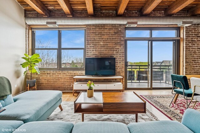 1735 W Diversey Pkwy Unit 402, Chicago, IL 60614 - living area with wood ceiling with exposed beams, brick wall, and wood finished floors