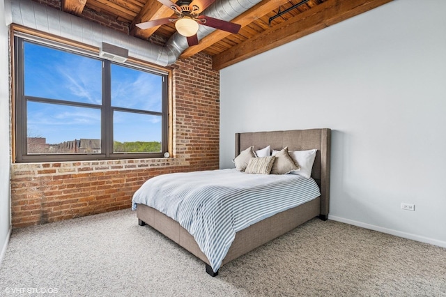 1735 W Diversey Pkwy Unit 402, Chicago, IL 60614 - carpeted bedroom with brick wall, wood ceiling with exposed beams, ceiling fan, and baseboards