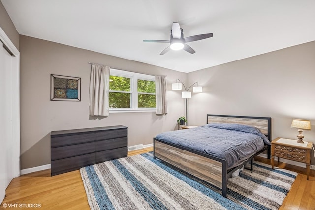 803 W Miner St, Arlington Heights, IL 60005 - bedroom with light wood finished floors, baseboards, a closet, and ceiling fan