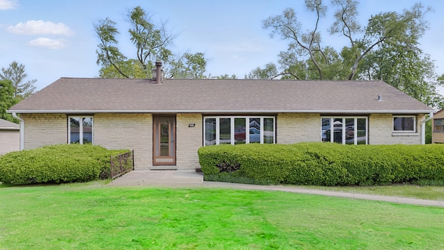540 W Madison St, Lombard, IL 60148 - view of front of home featuring a front lawn, roof with shingles, and brick siding