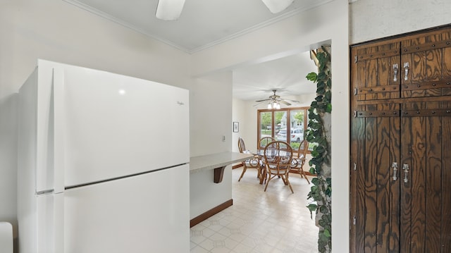 540 W Madison St, Lombard, IL 60148 - kitchen with freestanding refrigerator, a ceiling fan, baseboards, ornamental molding, and light countertops