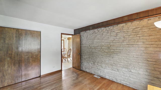 540 W Madison St, Lombard, IL 60148 - unfurnished bedroom with a closet and wood finished floors