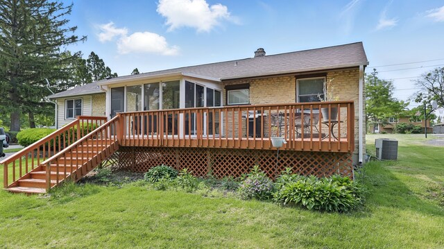 540 W Madison St, Lombard, IL 60148 - rear view of property with a sunroom, stone siding, a wooden deck, central AC unit, and a yard