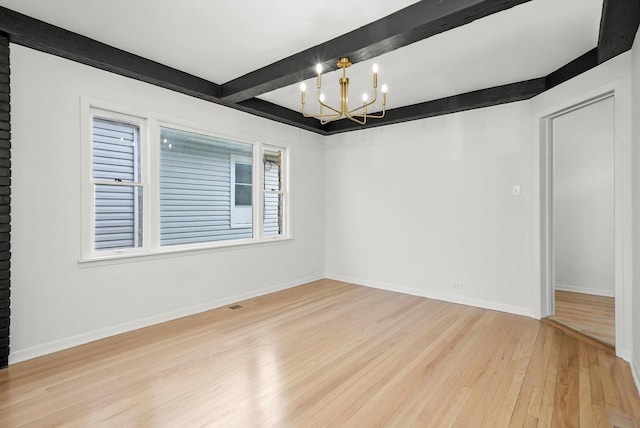 3633 N Lotus Ave, Chicago, IL 60641 - empty room with hardwood / wood-style flooring, beam ceiling, and a chandelier