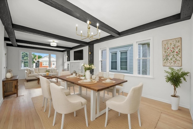 3633 N Lotus Ave, Chicago, IL 60641 - dining room featuring light wood-style flooring, beamed ceiling, and a chandelier