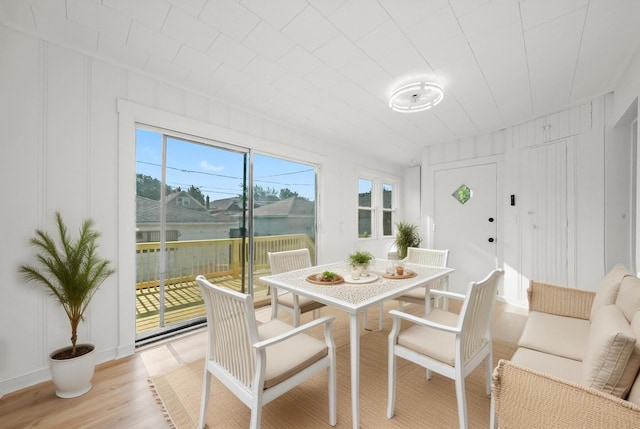 3633 N Lotus Ave, Chicago, IL 60641 - dining space with a decorative wall and light wood finished floors