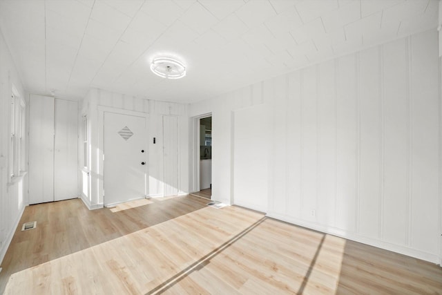 3633 N Lotus Ave, Chicago, IL 60641 - foyer with light wood-type flooring and a decorative wall