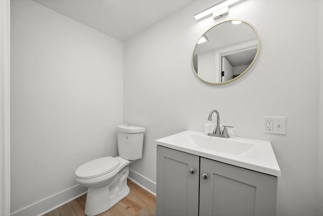 3633 N Lotus Ave, Chicago, IL 60641 - half bath featuring wood finished floors and vanity