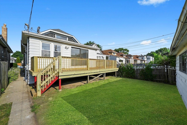 3633 N Lotus Ave, Chicago, IL 60641 - back of property with a fenced backyard and a deck