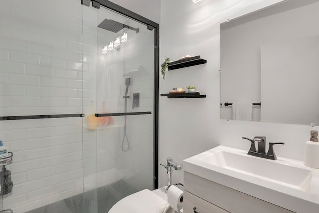 1550 N Lake Shore Dr Unit 9F, Chicago, IL 60610 - bathroom with vanity, a stall shower, and toilet