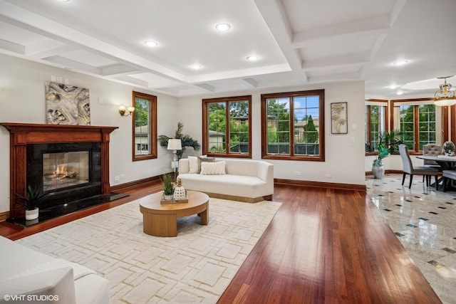 3832 W Chase Ave, Lincolnwood, IL 60712 - living room with coffered ceiling, healthy amount of natural light, wood finished floors, a high end fireplace, and recessed lighting