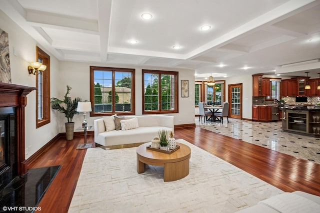 3832 W Chase Ave, Lincolnwood, IL 60712 - living area featuring a glass covered fireplace, wood finished floors, coffered ceiling, beam ceiling, and recessed lighting