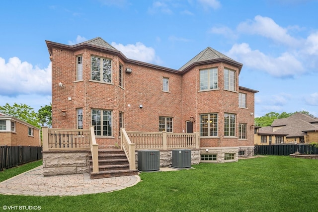 3832 W Chase Ave, Lincolnwood, IL 60712 - rear view of house with brick siding, a wooden deck, and a patio