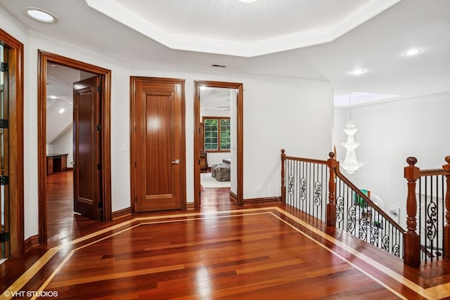 3832 W Chase Ave, Lincolnwood, IL 60712 - hall featuring hardwood / wood-style flooring, an upstairs landing, a chandelier, a tray ceiling, and recessed lighting