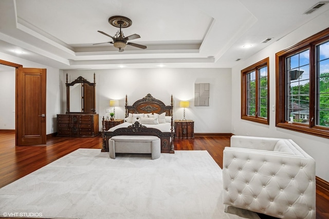 3832 W Chase Ave, Lincolnwood, IL 60712 - bedroom featuring a raised ceiling, wood finished floors, and ceiling fan