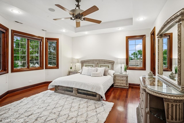 3832 W Chase Ave, Lincolnwood, IL 60712 - bedroom featuring a raised ceiling, multiple windows, dark wood-type flooring, recessed lighting, and a ceiling fan