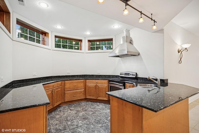 3832 W Chase Ave, Lincolnwood, IL 60712 - kitchen featuring stainless steel electric stove, island exhaust hood, a peninsula, brown cabinets, and dark stone counters