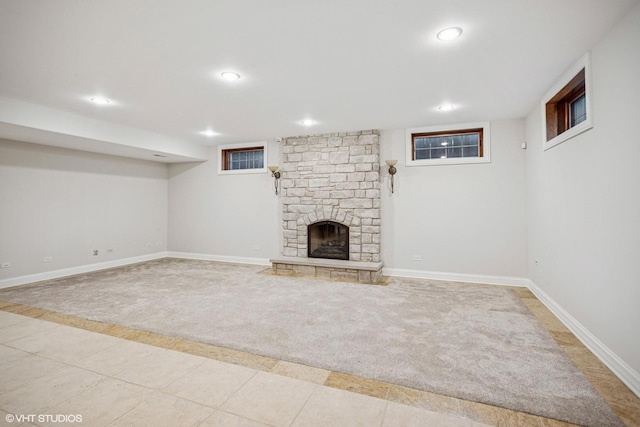 3832 W Chase Ave, Lincolnwood, IL 60712 - finished basement featuring carpet floors, recessed lighting, a stone fireplace, and tile patterned flooring