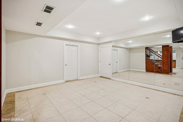 3832 W Chase Ave, Lincolnwood, IL 60712 - finished below grade area with stairway, recessed lighting, and light tile patterned floors