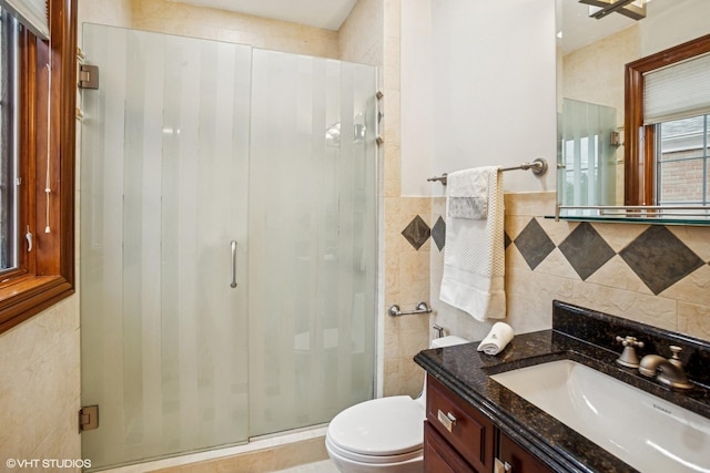 3832 W Chase Ave, Lincolnwood, IL 60712 - bathroom with tile walls, a shower stall, and vanity