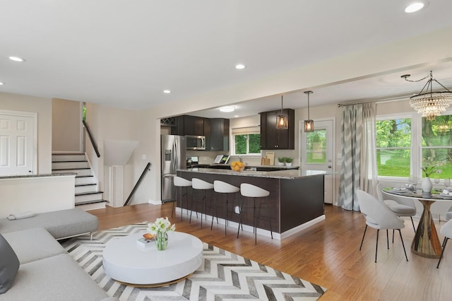 354 W Pleasant Hill Blvd, Palatine, IL 60067 - living room with wood finished floors, recessed lighting, stairs, and a chandelier