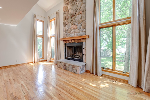 26371 N Elmwood Ave, Mundelein, IL 60060 - unfurnished living room with a fireplace, lofted ceiling, and wood finished floors