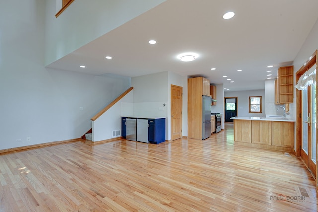 26371 N Elmwood Ave, Mundelein, IL 60060 - unfurnished living room featuring light wood-style floors, recessed lighting, and stairs