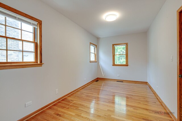 26371 N Elmwood Ave, Mundelein, IL 60060 - empty room featuring light wood-style floors