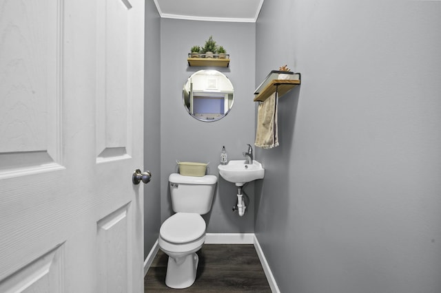 215 Cypress Dr, Streamwood, IL 60107 - bathroom with toilet, wood finished floors, baseboards, crown molding, and a sink