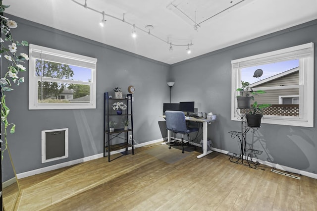 215 Cypress Dr, Streamwood, IL 60107 - office area with track lighting, wood finished floors, plenty of natural light, and baseboards