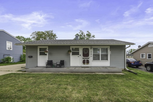215 Cypress Dr, Streamwood, IL 60107 - view of front of property with a front yard, covered porch, and roof with shingles