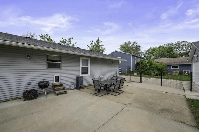 215 Cypress Dr, Streamwood, IL 60107 - view of patio featuring outdoor dining space, area for grilling, and a gate