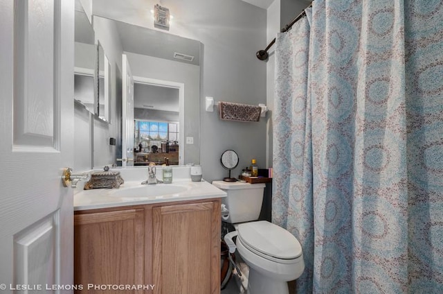 2402 Oakfield Ct, Aurora, IL 60503 - full bathroom with vanity, toilet, and a shower with curtain