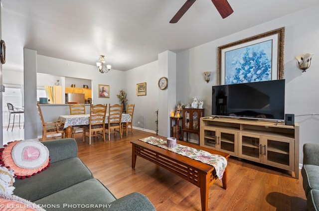 2402 Oakfield Ct, Aurora, IL 60503 - living area with a ceiling fan, wood finished floors, and a chandelier