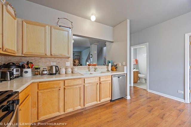 2402 Oakfield Ct, Aurora, IL 60503 - kitchen with stainless steel appliances, a sink, light brown cabinetry, backsplash, and light wood-style flooring