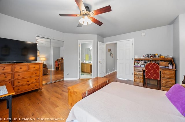 2402 Oakfield Ct, Aurora, IL 60503 - bedroom with wood finished floors, baseboards, ensuite bathroom, ceiling fan, and a closet