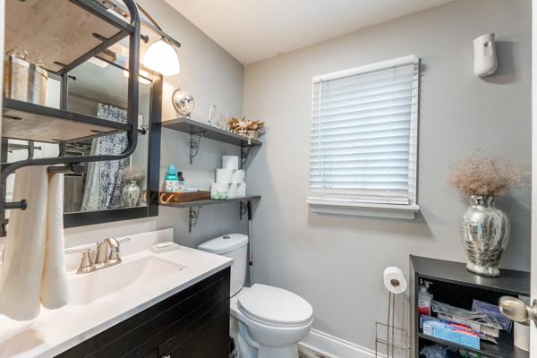 426 Greentree Ln, Bolingbrook, IL 60440 - bathroom with toilet, vanity, and baseboards