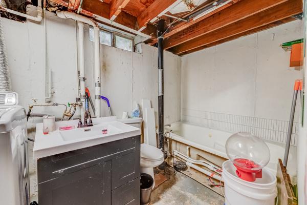426 Greentree Ln, Bolingbrook, IL 60440 - unfinished basement featuring washer / dryer and a sink