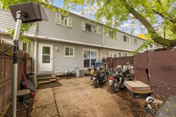 426 Greentree Ln, Bolingbrook, IL 60440 - rear view of house with entry steps, a fenced backyard, and cooling unit