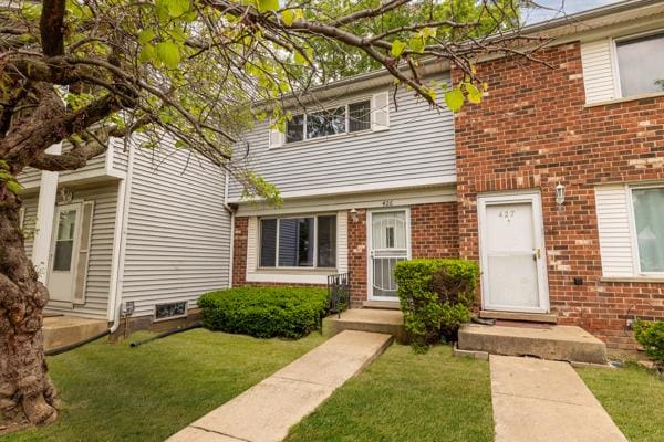 426 Greentree Ln, Bolingbrook, IL 60440 - view of front facade featuring brick siding and a front yard