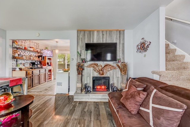 426 Greentree Ln, Bolingbrook, IL 60440 - living room featuring wood finished floors, stairs, and a large fireplace