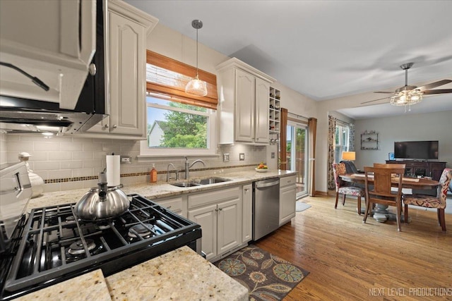2937 Arbor Ln, Aurora, IL 60502 - kitchen featuring stainless steel appliances, healthy amount of natural light, decorative backsplash, and wood finished floors