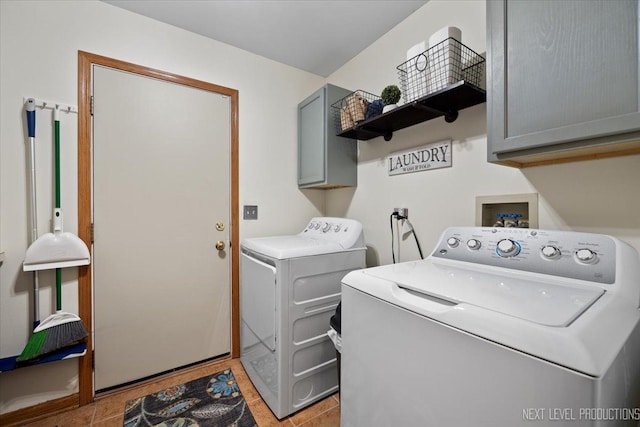 2937 Arbor Ln, Aurora, IL 60502 - laundry room with cabinet space, washing machine and clothes dryer, and light tile patterned floors