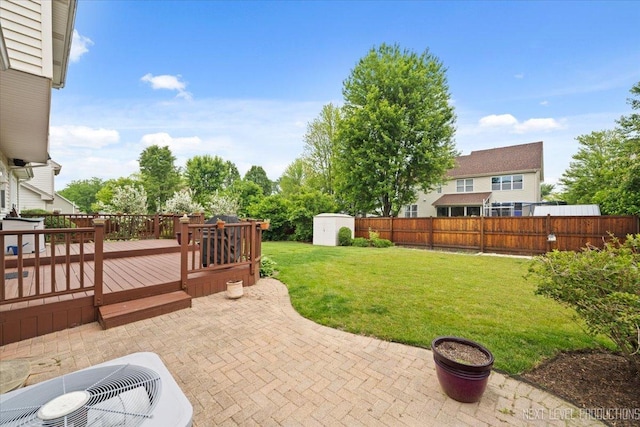 2937 Arbor Ln, Aurora, IL 60502 - fenced backyard with a storage shed, a patio area, and a deck