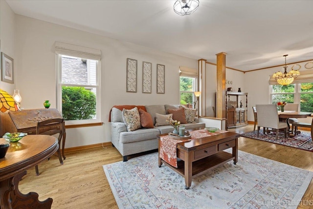 2937 Arbor Ln, Aurora, IL 60502 - living area with plenty of natural light, a chandelier, and light wood-style floors