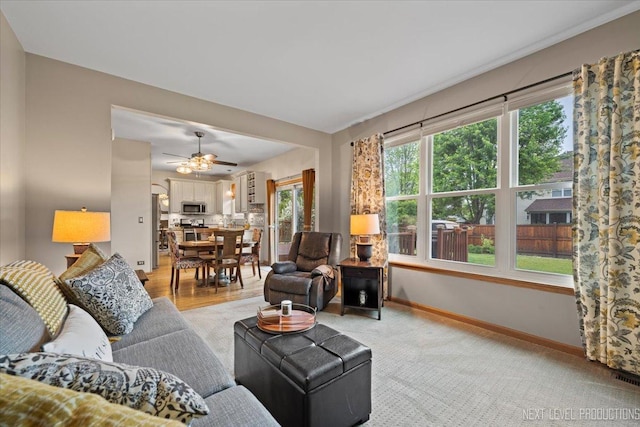 2937 Arbor Ln, Aurora, IL 60502 - living area featuring a ceiling fan and light carpet