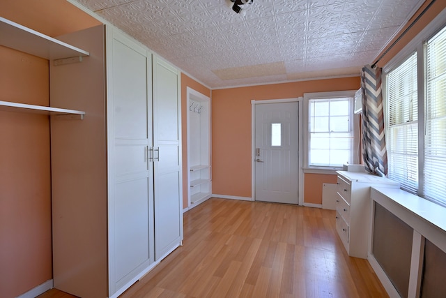 2827 N 77th Ct, Elmwood Park, IL 60707 - entryway with an ornate ceiling, light wood-style floors, and baseboards