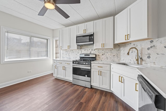 9431 S 79th Ave Unit 105N, Hickory Hills, IL 60457 - kitchen with appliances with stainless steel finishes, a sink, backsplash, and white cabinetry