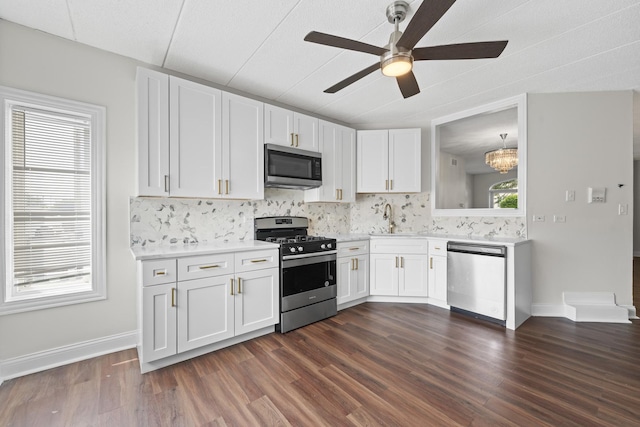 9431 S 79th Ave Unit 105N, Hickory Hills, IL 60457 - kitchen featuring stainless steel appliances, ceiling fan, light countertops, decorative backsplash, and a sink